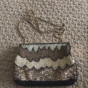 Gold and black evening clutch or shoulder bag.